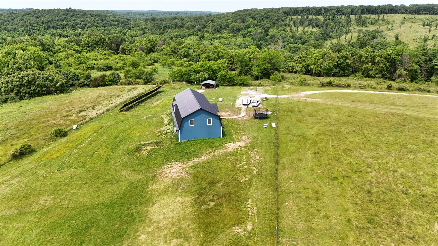 The blue barndominium and workshop on the Mysliwiec Family Farm